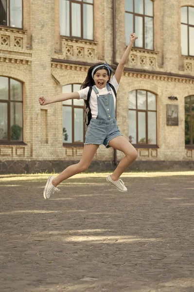 Surprised Denim Girl Backpack Jumping Outdoor — Stockfoto