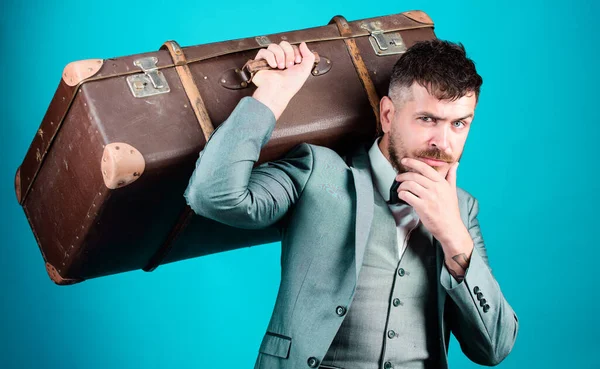 Take all your things with you. Heavy suitcase. Delivery service. Travel and baggage concept. Hipster traveler with baggage. Baggage insurance. Man well groomed bearded hipster with big suitcase.