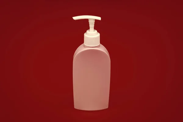 Turuncu Arka Planda Yenilenebilir Plastik Sıvı Kozmetik Ambalaj Kabı — Stok fotoğraf