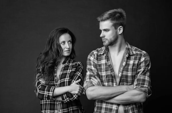 misunderstanding of sexy man and woman together in checkered shirt, relations.