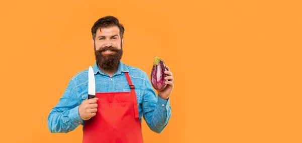Happy Man Apron Holding Cooks Knife Eggplant Yellow Background Copy — Stockfoto