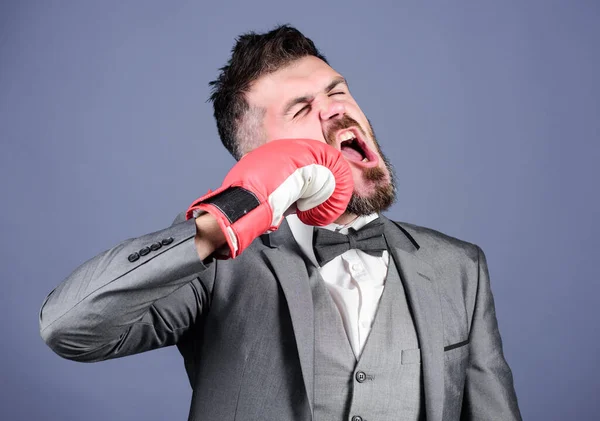 knockout and energy. Fight. bearded man in boxing gloves punching. businessman in formal suit and tie. Business sport success. powerful man boxer ready for corporate battle. Business professionals.