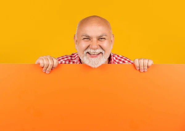 laughing senior man with copy space on blank banner. advert.