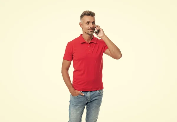 Man Red Tshirt Speaking Cell Phone Isolated White Background — Zdjęcie stockowe
