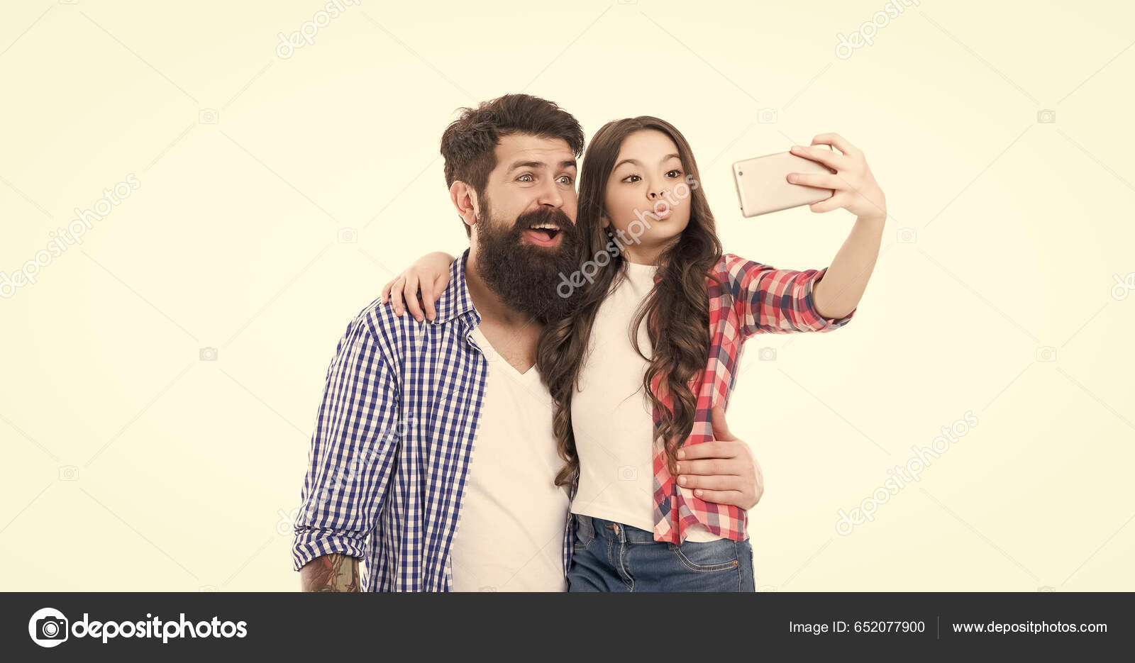 Father Kissing Daughter On Forehead Posing In Studio Portrait High-Res  Stock Photo - Getty Images
