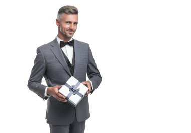 glad man in blue suit with gift box isolated on white. valentines day.