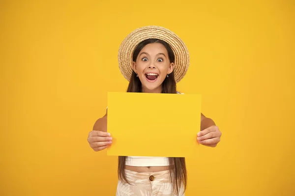 Surprised Teen Girl Hold Empty Advertisement Paper Copy Space Yellow — 스톡 사진