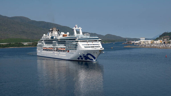 Ketchikan, Alaska USA - May 27, 2019: huge cruise ship coral princess voyage with landscape.