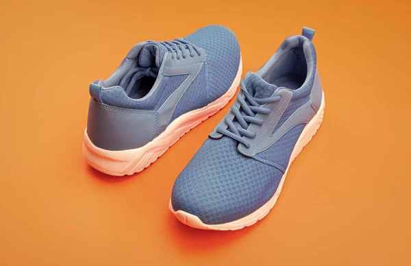 Sporty Blue Sneakers Pair Orange Background Fitness — 스톡 사진