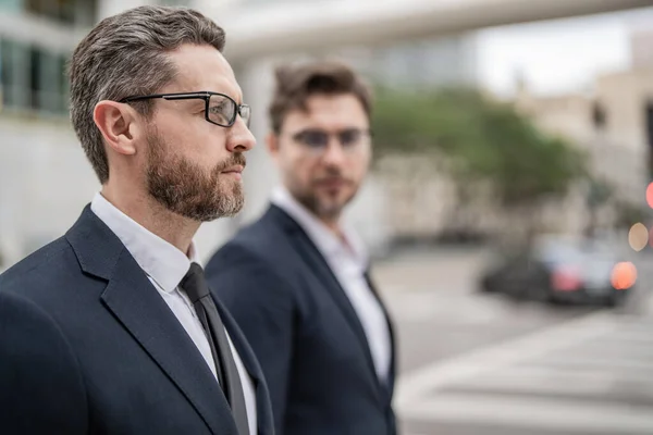 successful business leader boss in suit with selective focus. successful business leader boss outdoor. photo of two successful business leader boss. successful business leader boss men.