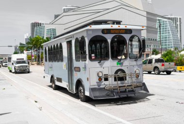 Miami Beach, Florida USA - April 15, 2021: blue miami dade public bus, corner view.