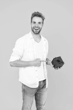 smiling man with present in studio. man with present on background. photo of man with present box. man with present isolated on white.