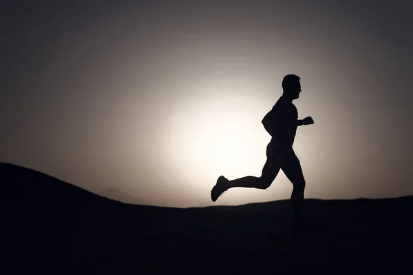 stock image running man on mountain nature landscape on sky background in summer or spring, business and success, energy fitness, gym and health, sport and recreation