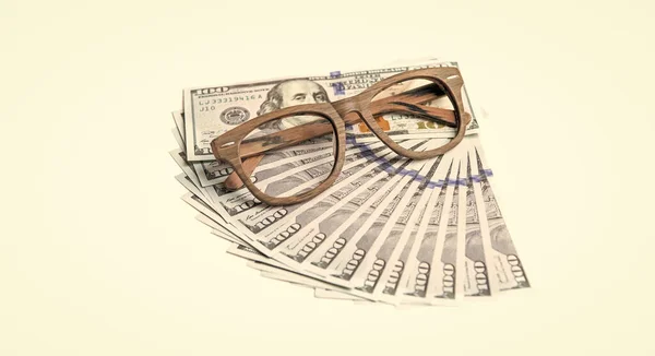 money and glasses isolated on white background. concept of finance. photo of finance money in studio. finance symbol is money banknotes. money and finance.