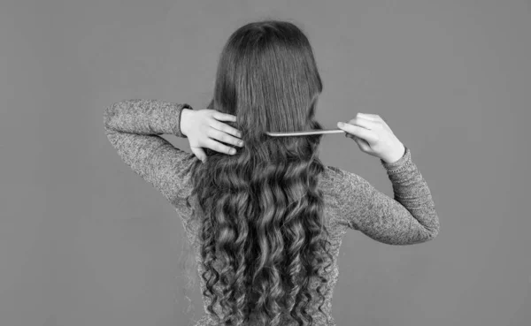 Back View Teen Girl Combing Curly Hair Hairbrush Pink Background — Foto Stock