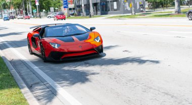 Miami Beach, Florida USA - April 15, 2021: red Lamborghini Aventador LP 750-4 SV, front view.