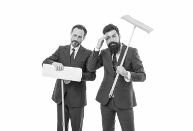 businessmen clear wall to white. clean slate. Partnership and teamwork. cleaning company. clean business. mature bearded men in suit hold householding mop. they have clean slate. clean slate concept.