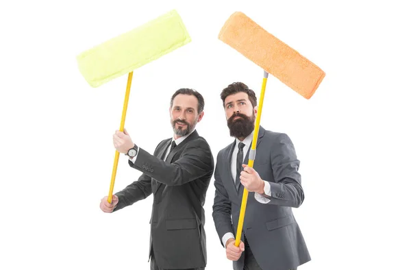 cleaning company. clean business. Partnership and teamwork. businessmen clear to white. cleaning company concept. clean slate. mature bearded men in suit hold householding mop. cleaning company ad.