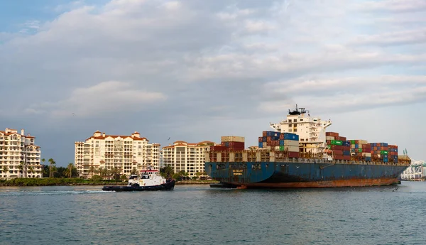 Miami Beach, Florida USA - April 18, 2021: cargo ship with containers in port of miami beach.