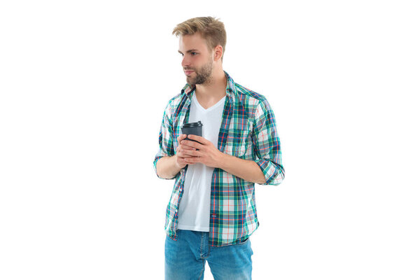 photo of millennial man holding coffee. millennial man with coffee isolated on white. millennial man with coffee on background. millennial man with coffee in studio.