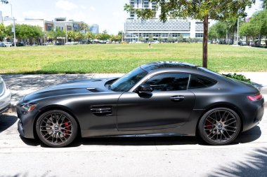 Miami Beach, Florida USA - April 15, 2021: matte mercedes benz v8 biturbo, side view high angle.