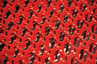 bright repetition background with selective focus. repetition background with dancing figures. photo of repetition background. repetition background red color.