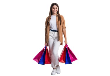 Tam boyda, alışveriş meraklısı bir kız. Stüdyoda alışveriş meraklısı bir genç kız. Arka planda alışveriş meraklısı bir genç kız. Torbalı genç kız fotoğrafı..