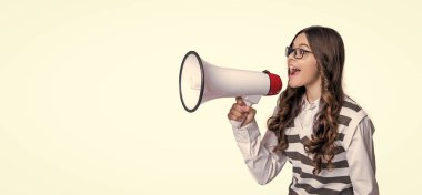 photo of teen girl announcer with megaphone, advertisement. teen girl announcer isolated on white. teen girl announcer in studio. teen girl announcer on background. clipart