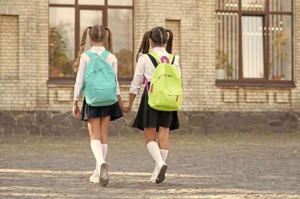 Back View Two Sisters School Backpack Walking Together Outdoor — Stockfoto