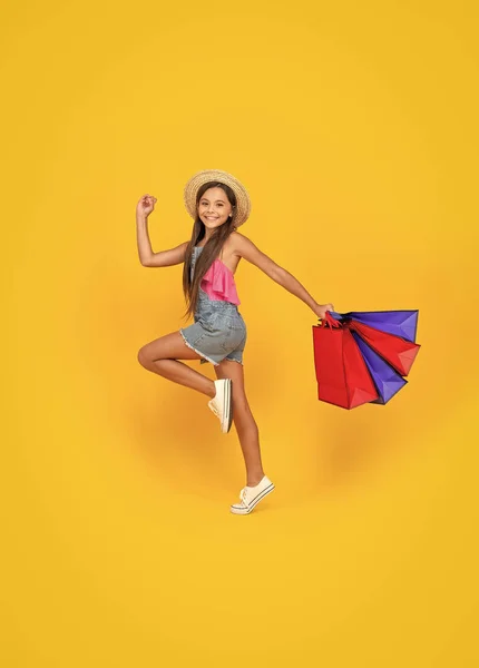 Happy Teen Kid Run Shopping Bags Yellow Background Full Length — Stock Photo, Image