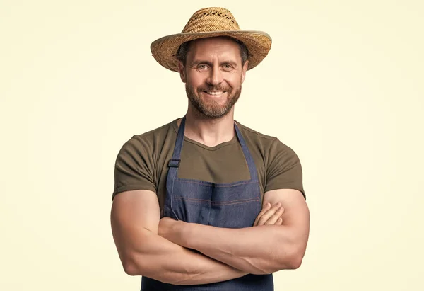 happy caucasian man in hat and apron isolated on white background.