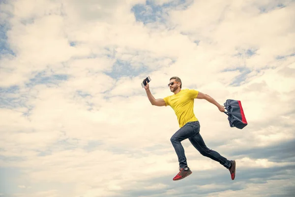 Energetic Guy Running Travel Bag Midair Sky Background Copy Space — ストック写真