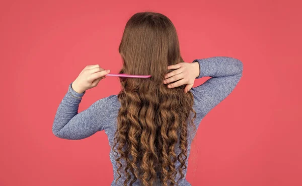 Back View Teen Girl Combing Curly Hair Hairbrush Pink Background — 스톡 사진
