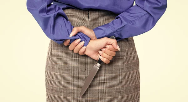 cropped view of woman with crime knife isolated on white. woman going to murder in studio. woman hold knife for murder crime. revenge concept. woman revenge by crime murder with knife behind.