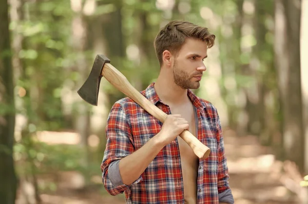 Unshaven Man Lumberjack Shirt Looking Aside Holding Axe Shoulder Forest — Fotografia de Stock
