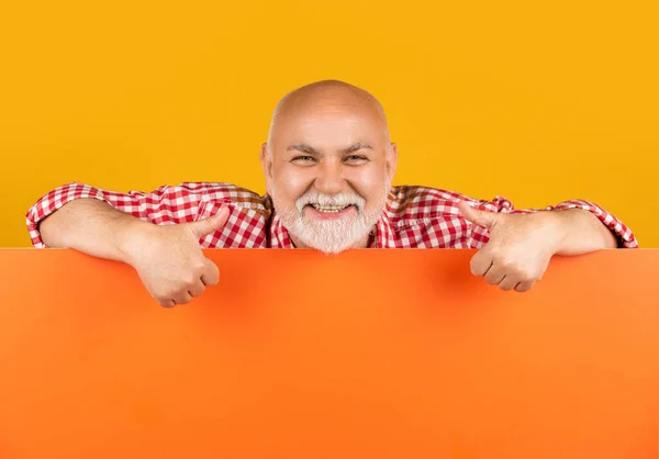 stock image positive senior man with copy space on blank banner. promotion.