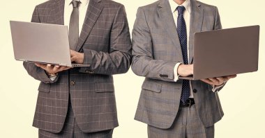 cropped view of two businessmen freelance using laptop. businessmen freelance isolated on white background. businessmen freelance in studio. photo of businessmen freelance with laptop.