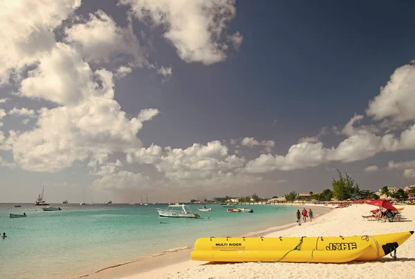 stock image Bridgetown, Barbados - December 12, 2015: summer beach with banana boat.