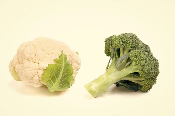 fresh and ripe cauliflower and broccoli isolated on white.