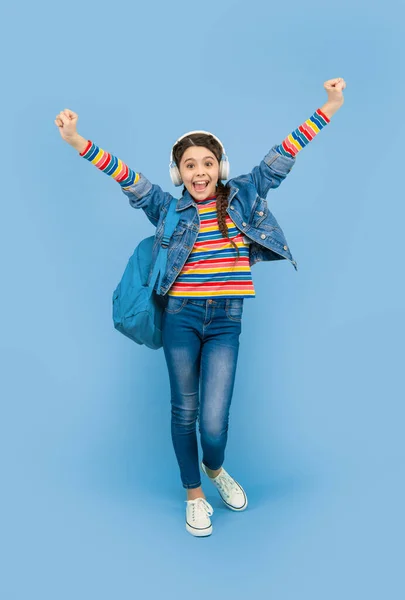 Happy Teen Girl Making Winning Gesture Blue Background School Music — Foto Stock