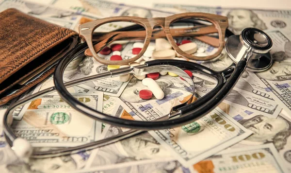 stock image medicine finance in studio. charity savings. photo of medicine finance money. medicine finance concept. money for medicine finance in closeup and selective focus.