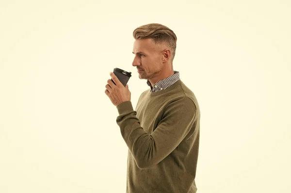 stock image man drinking coffee isolated on white. man drinking coffee in studio. man drinking coffee on background. photo of man drinking coffee.