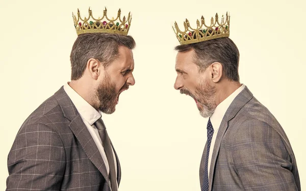 stock image confrontation of businessmen shout in crown isolated on white. confrontation of businessmen in crown at studio. confrontation of businessmen in crown. photo of confrontation of businessmen in crown.