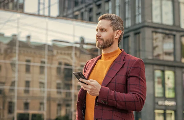 stock image businessman chat on smartphone outdoor. smartphone business communication. businessman with smartphone. handsome businessman chat on smartphone.