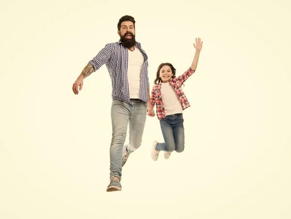 Jump high and love your family. Happy family. Family of father and little daughter jumping with joy. Bearded man and small girl child celebrating family day together.