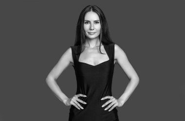 elegant woman isolated on red. elegant woman in studio. elegant woman on background. photo of elegant woman in formalwear.