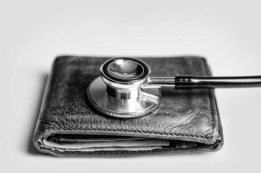 closeup of stethoscope and wallet as symbol of medical insurance. life planning and medical insurance. medical insurance concept.