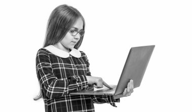 teen school girl elearning in studio. teen girl elearning on laptop. photo of elearning school teen girl. education online. teen girl elearning at school online isolated on white background.
