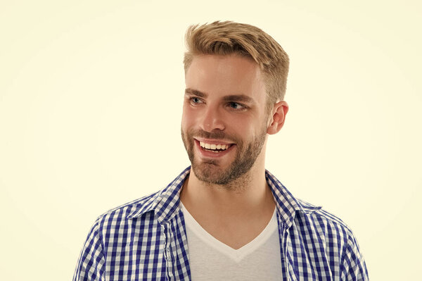 smiling young man in studio. photo of young man wearing checkered shirt. young man isolated on white. young man on background.
