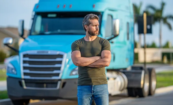 stock image Trucking owner. hispanic man posing in front of truck. Semi trucks vehicle. man driver near lorry truck. Man owner truck driver near truck. man driver near lorry. Semi trucks vehicle. true road.